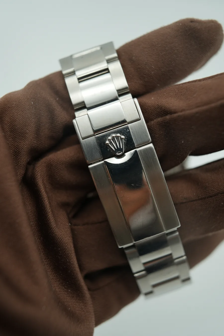 Rolex Daytona reference 116500LN with a white dial and black ceramic bezel, shown at an angle.