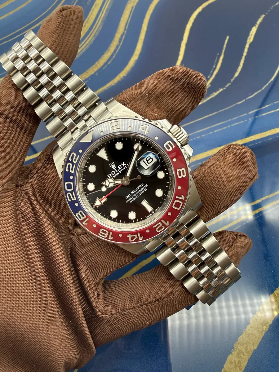 Rolex GMT-Master II photographed on its side, showing the bezel edge and crown guards.