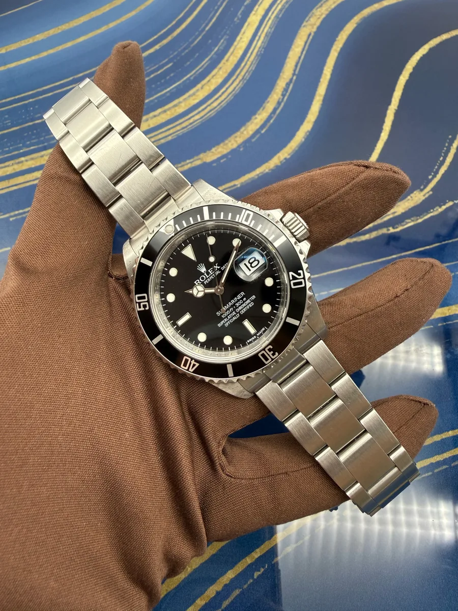 Rolex Submariner 16610 viewed from the side, lug edges and case flank visible.