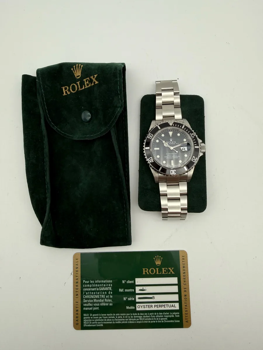Rolex Submariner 16610 shown from the side with the bracelet clasp open.